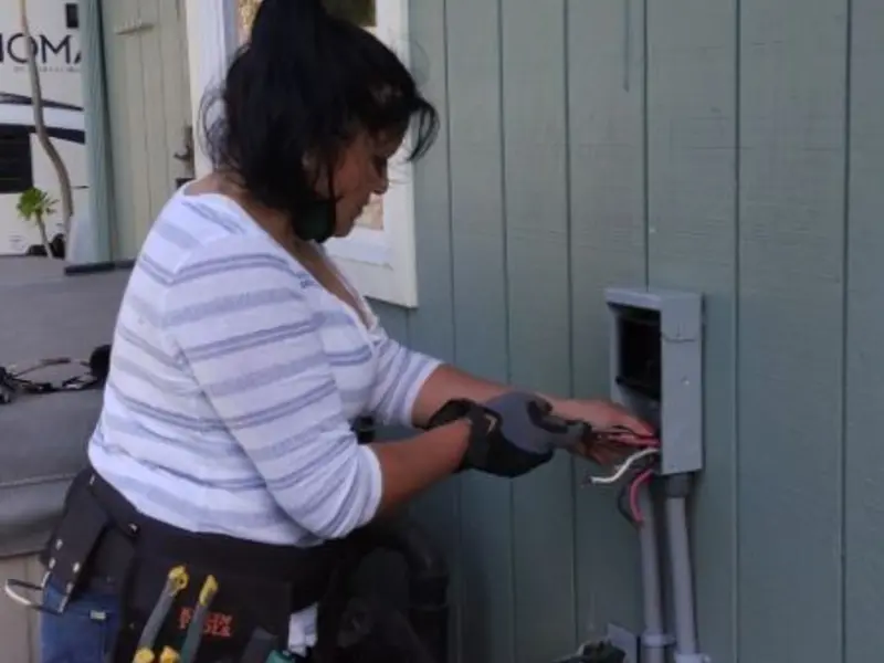Licensed electrician wiring an exterior subpanel in Coplay